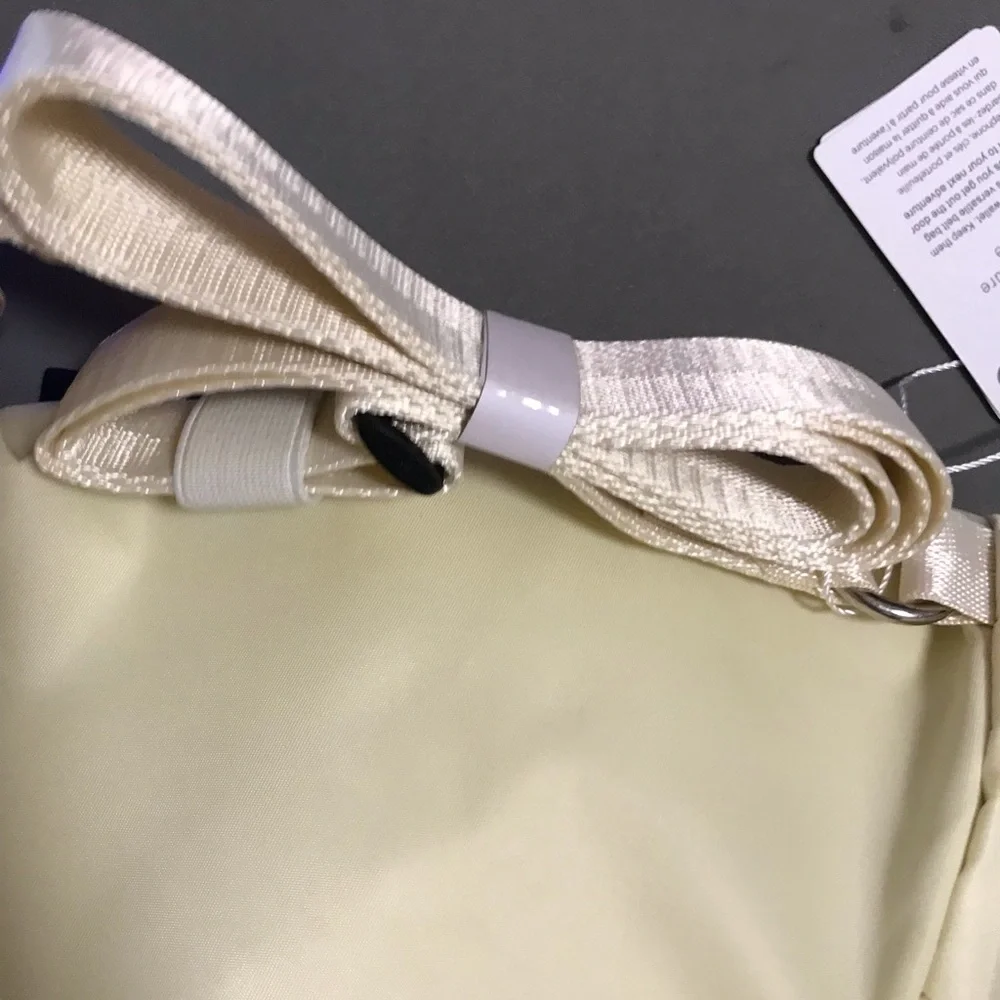 lululemon athletica cream fold-over wristlet with front zip 2L